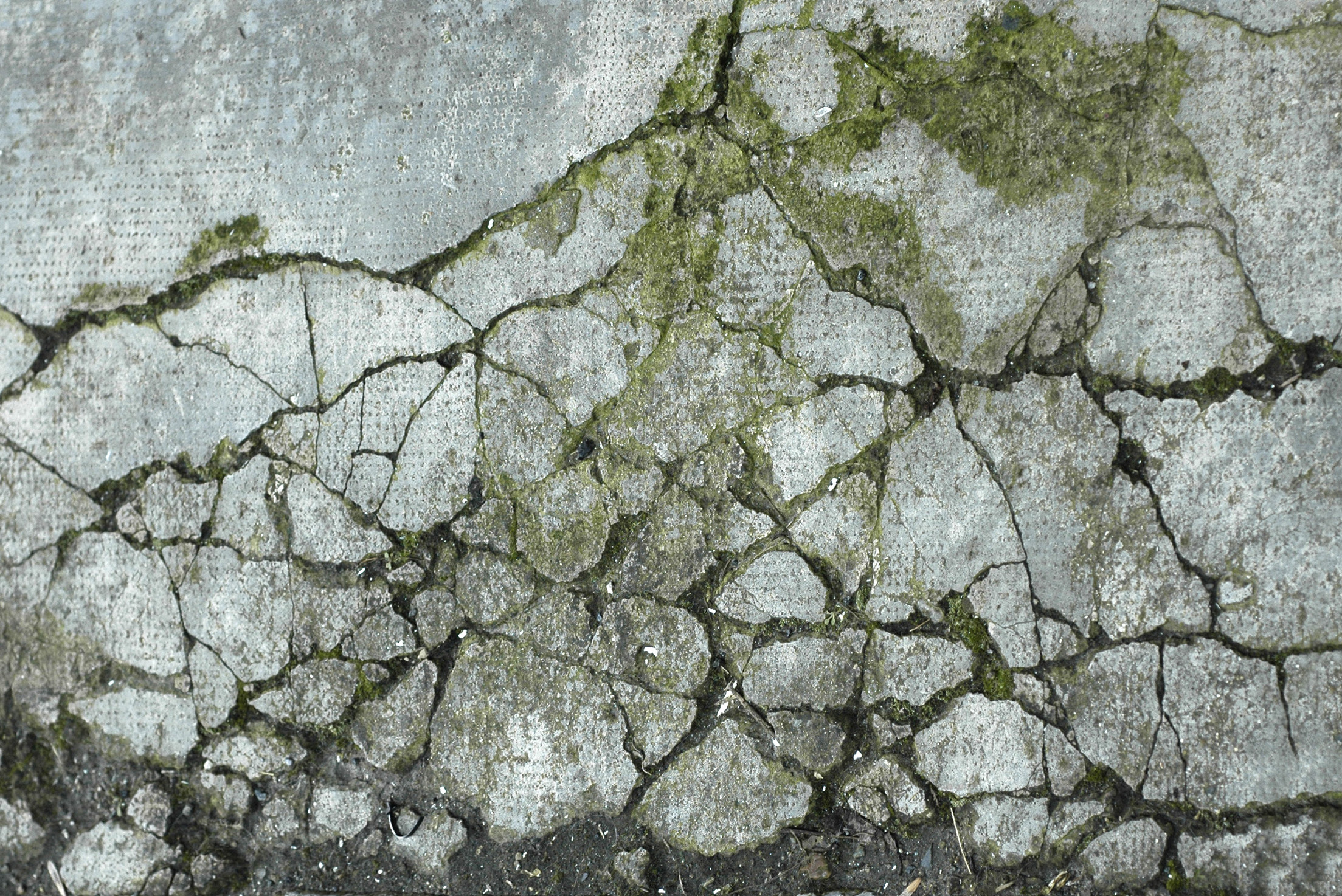 Damaged and broken asphalt background, texture